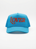 Blue cap with red 'LOVER' text on a white background Ruben Rojas Love hat 