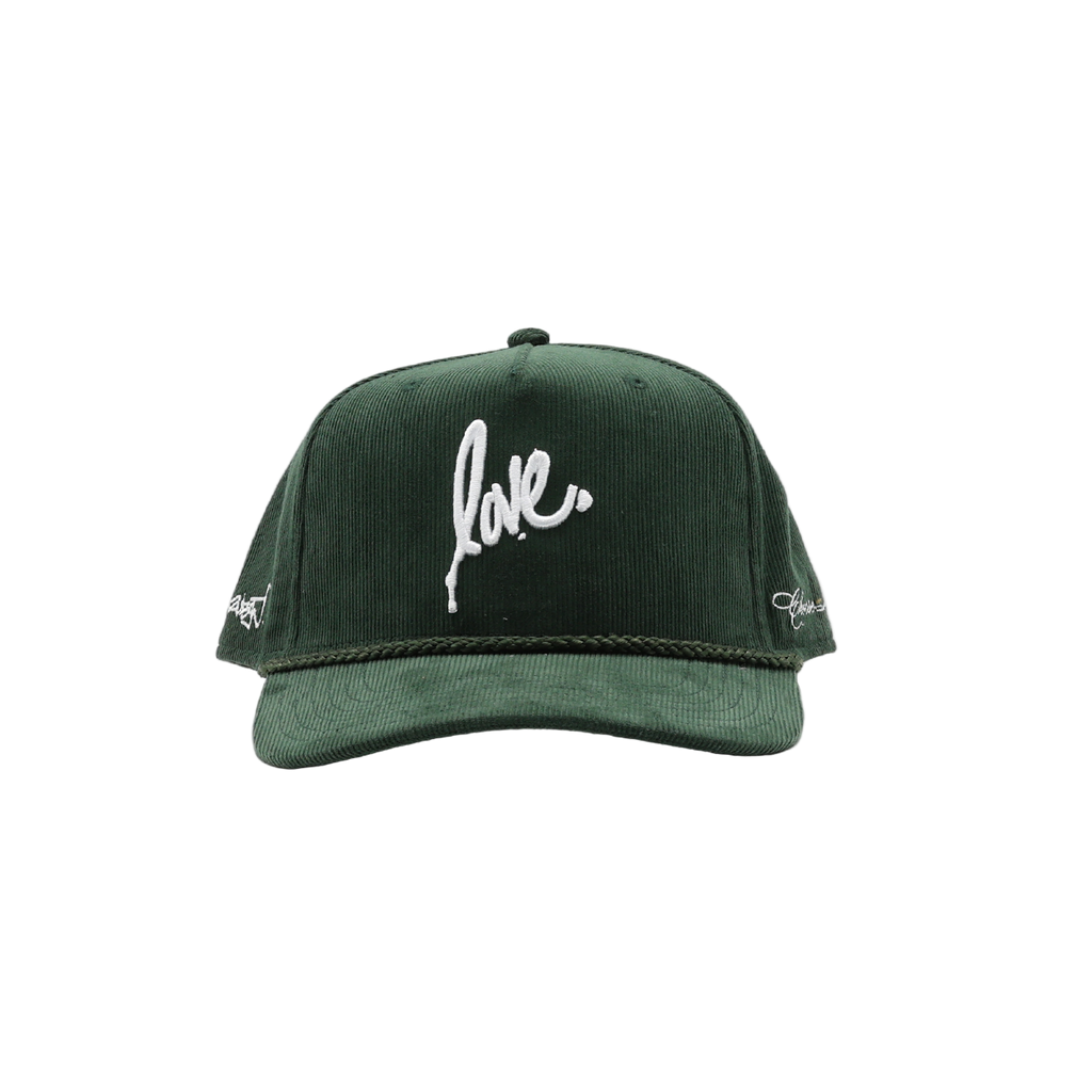 Green cap with 'love' embroidered on a white background