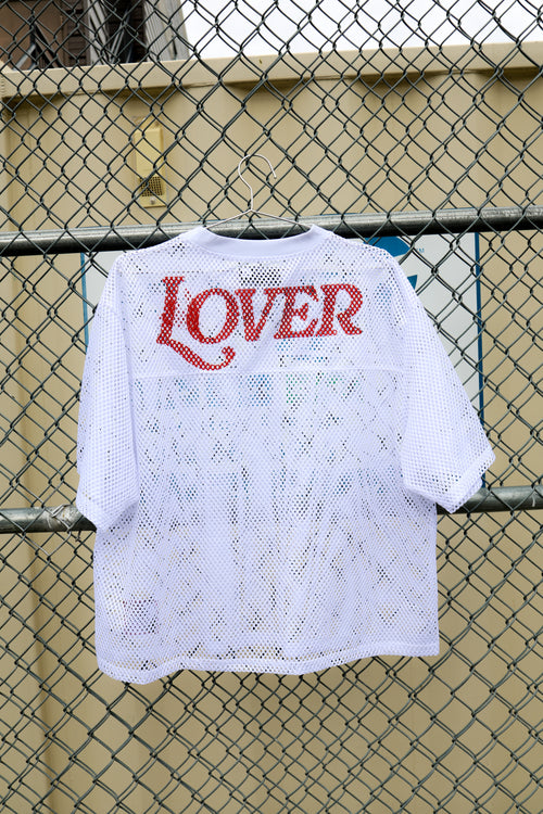The Lover Mesh Box Jersey in white, a breathable mesh jersey with a boxy cut