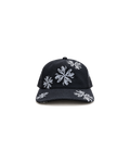 Love Flower Cap in Night Bloom black, front view, all-over white Love Flower print on washed cotton canvas