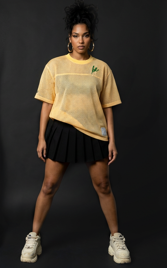 Two people wearing casual outfits against a black background